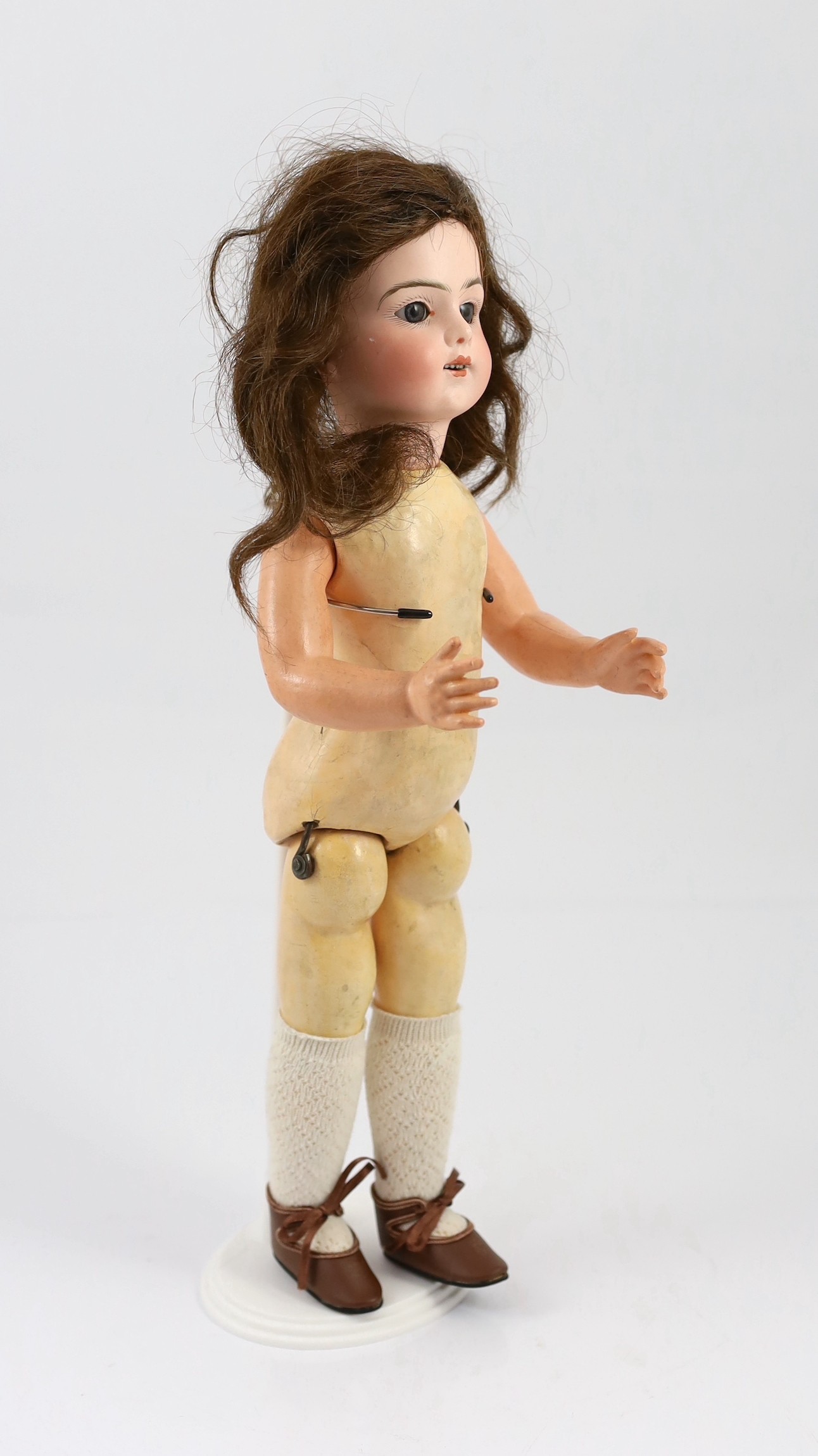 A Bru Jeune R. bisque Walking doll, French, circa 1890, 16in.